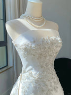 Elegant White Mermaid Strapless Beaded Satin Wedding Dress With Train